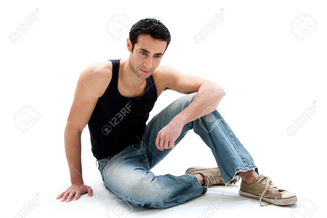 Handsome Caucasian guy wearing black tank top and jeans sitting on floor looking down, isolated - 4278039 Handsome Caucasian guy wearing black tank top and jeans sitting on floor looking down, isolated - 4278039
