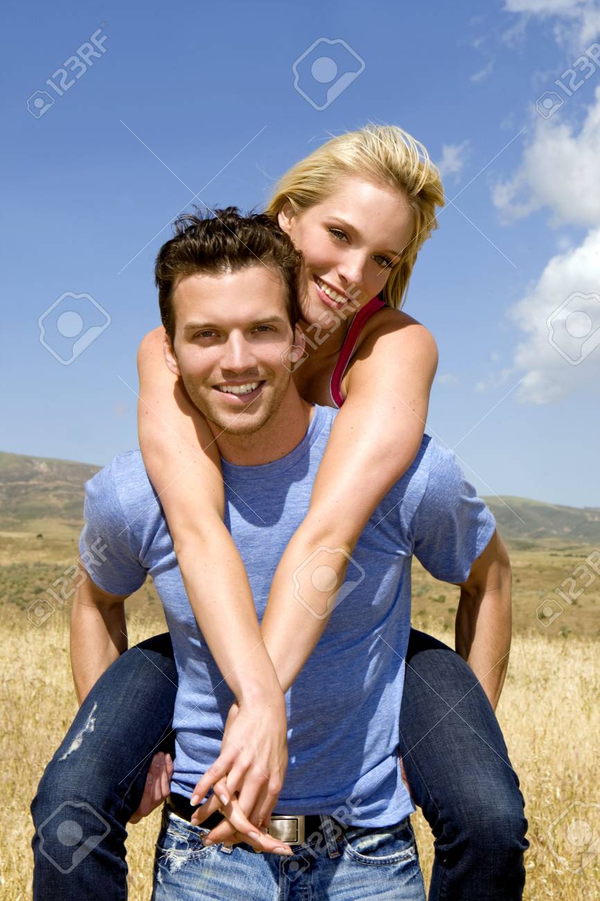 Attractive young couple playing outside - 4924083 Attractive young couple playing outside - 4924083