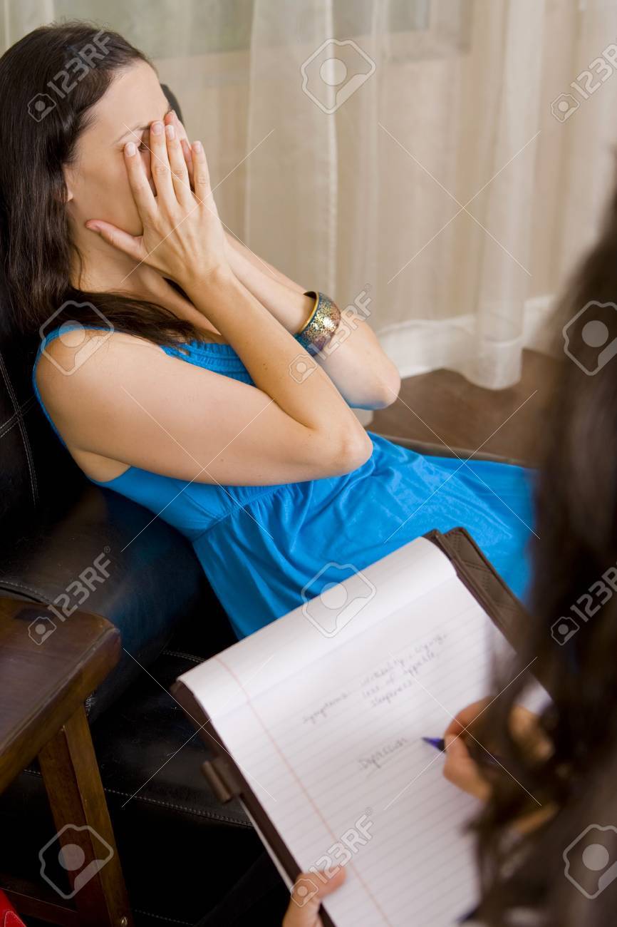 Depressed woman talking to her therapist - 5447300 Depressed woman talking to her therapist - 5447300