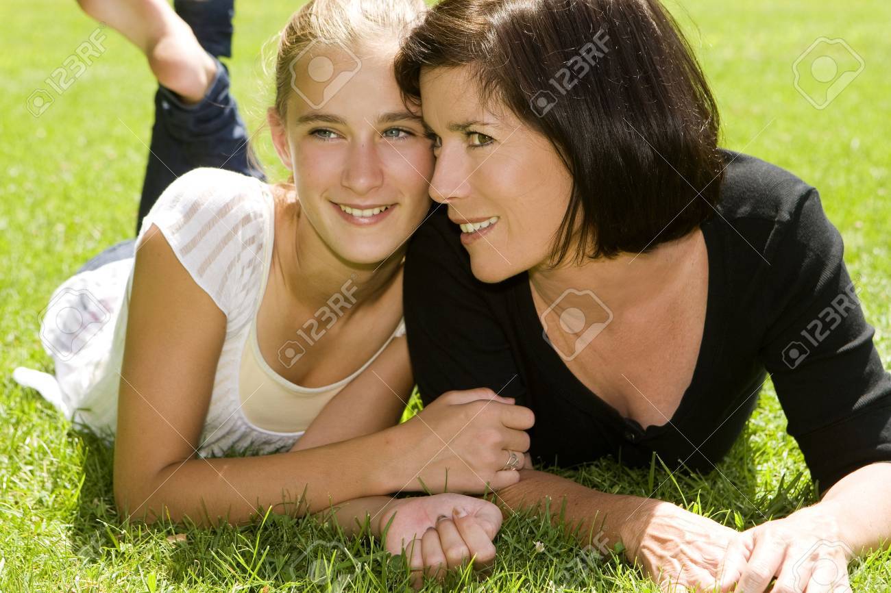 Mother and daughter outdoors on a Spring day - 5454957 Mother and daughter outdoors on a Spring day - 5454957
