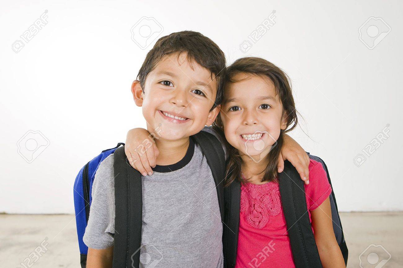 Little boy and girl with their book bags - 5679629 Little boy and girl with their book bags - 5679629