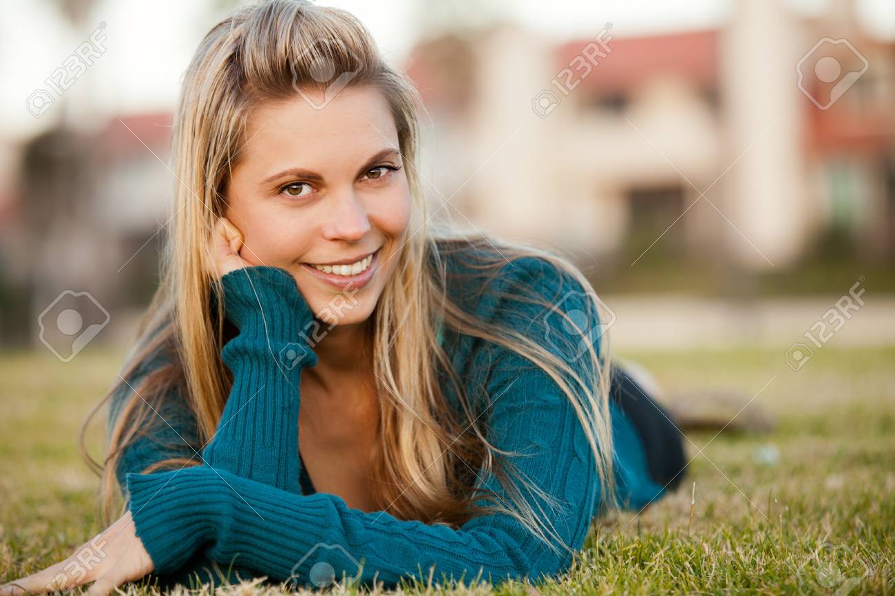 Portrait of beautiful happy young woman outside - 18303845 Portrait of beautiful happy young woman outside - 18303845