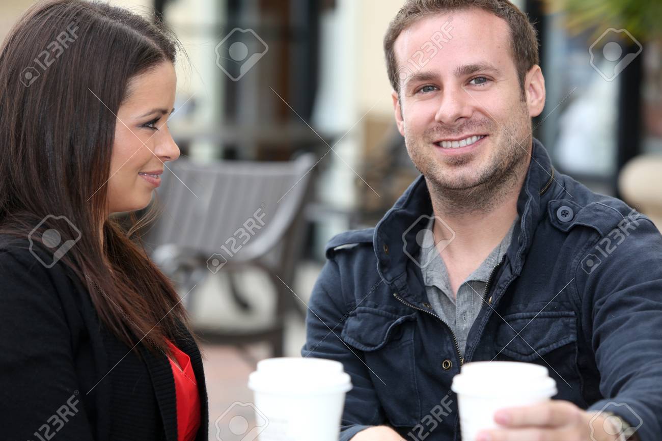 Young couple drinking coffee outside - 18304531 Young couple drinking coffee outside - 18304531
