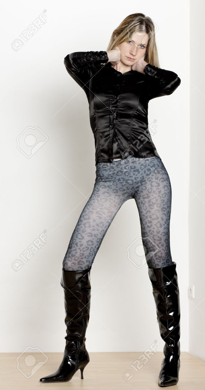 standing woman wearing fashionable boots stock photo picture and