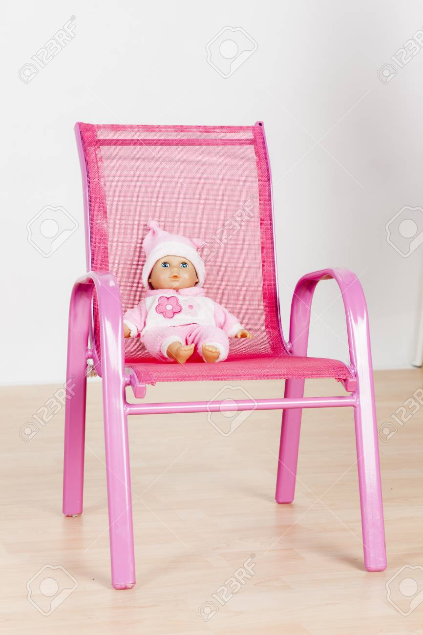 doll sitting in chair