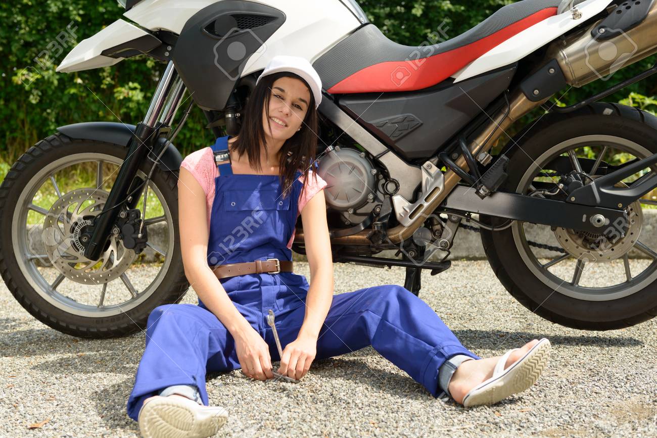 a student girl in motorbike mechanics motorcycle mechanics