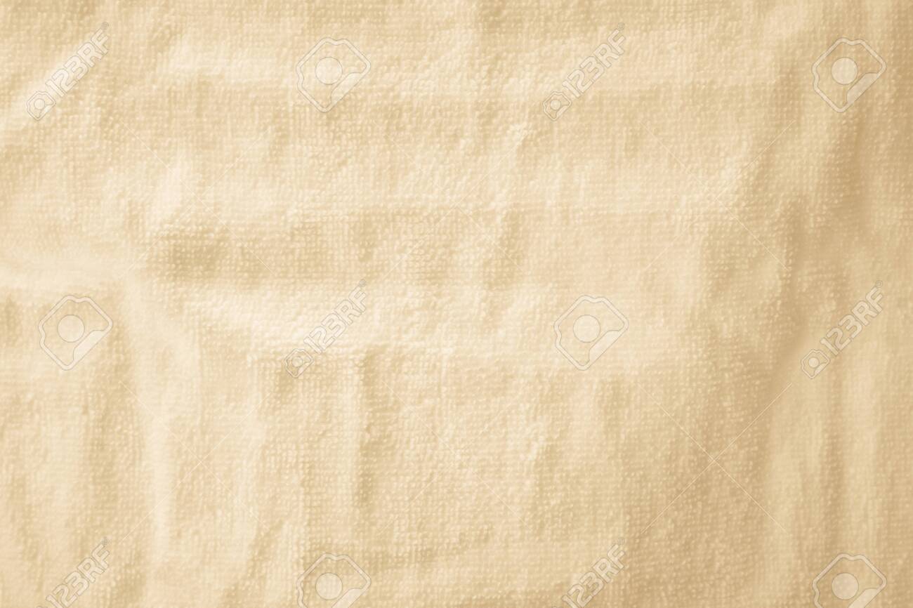 Cream Abstract Cotton Towel Mock Up Template Fabric On Background. Wallpaper  Of Artistic Wale Linen Canvas. Blanket Or Curtain Of Pattern And Copy Space  For Text Decoration. Stock Photo, Picture And Royalty