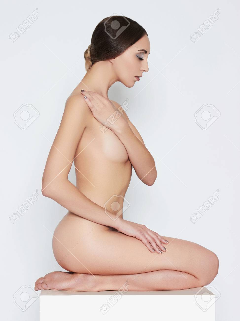 Nude Beautiful Woman. Naked Sexy Girl With Perfect Body Sitting On The  Floor Stock Photo, Picture and Royalty Free Image. Image 70933488.