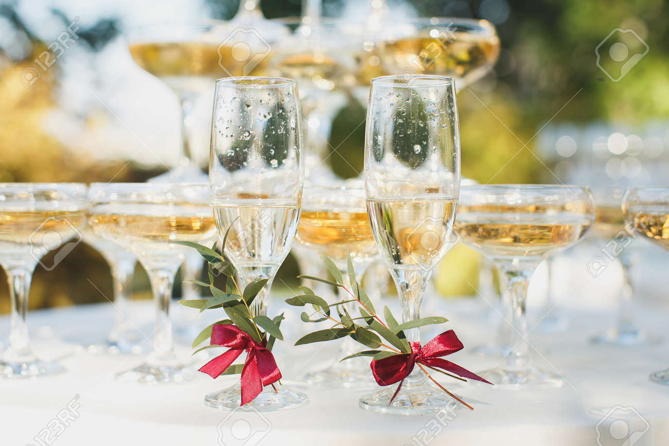 Beautiful hill with champagne at the Banquet for the newlyweds.
Glasses of the bride and groom. - 142709374 Beautiful hill with champagne at the Banquet for the newlyweds.
Glasses of the bride and groom. - 142709374