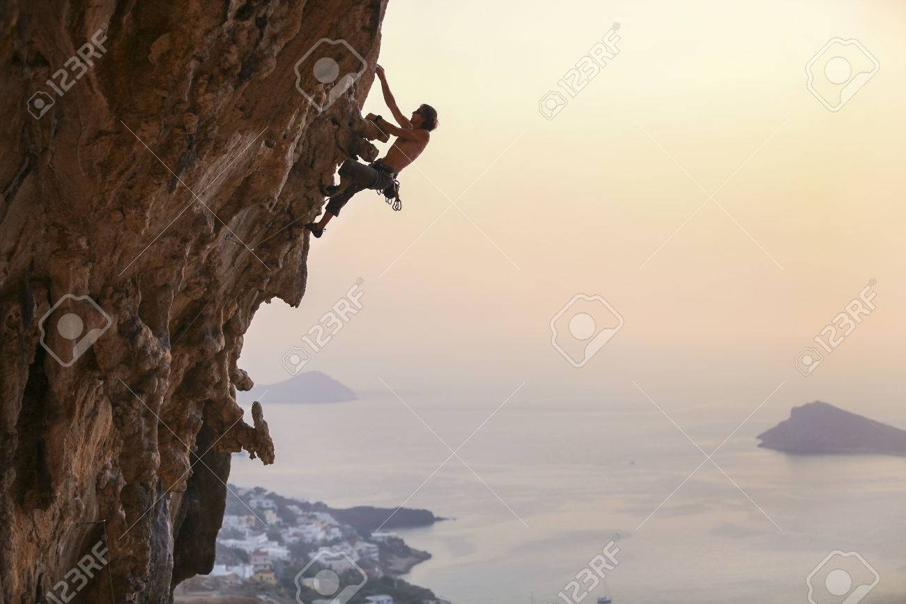 Male rock climber at sunset, Kalymnos Island, Greece - 49254019 Male rock climber at sunset, Kalymnos Island, Greece - 49254019