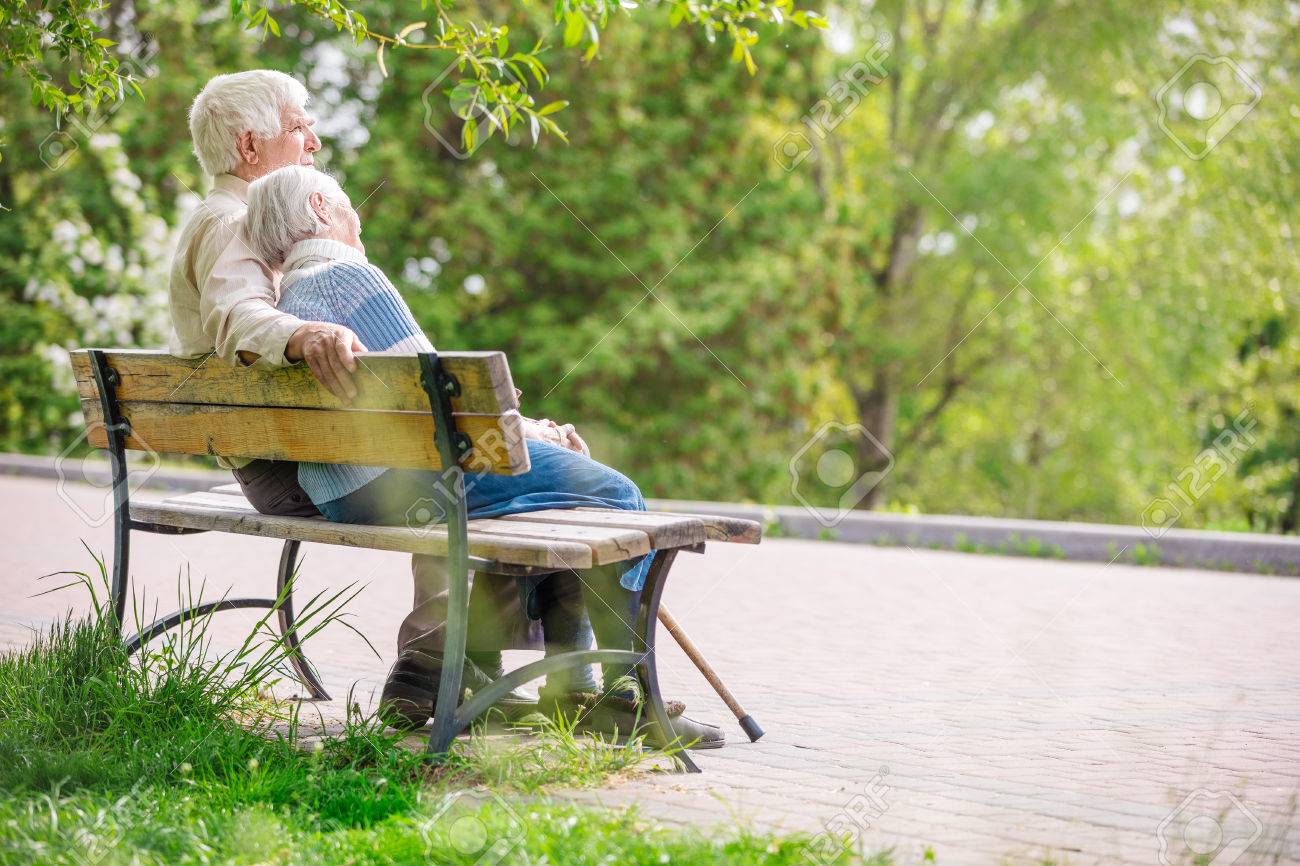 Elderly couple resting at the park - 58629402 Elderly couple resting at the park - 58629402