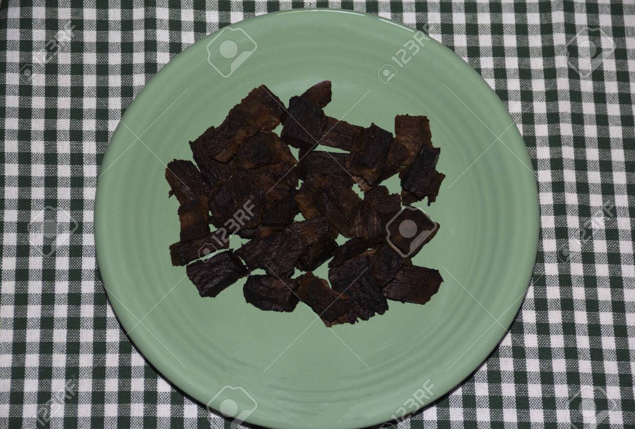 Pieces Of Burnt Meat On A Plate Inedible Food Wooden Rustic Stock Photo Picture And Royalty Free Image Image