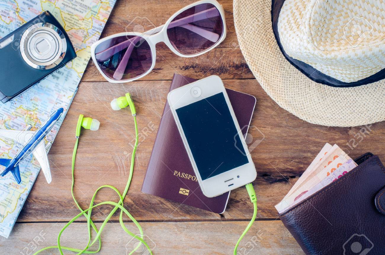 Travel accessories costumes. Passports, luggage, eyewear The cost of travel maps prepared for the trip - 52581337 Travel accessories costumes. Passports, luggage, eyewear The cost of travel maps prepared for the trip - 52581337