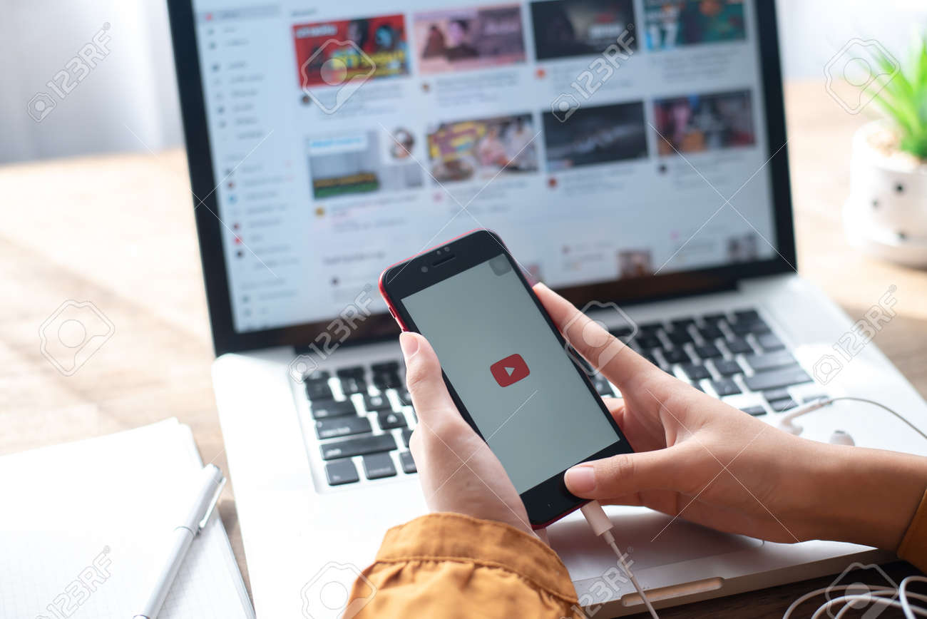 Lamphun, Thailand - June 21, 2020: In a hand for man with social networking service Youtube on the screen IPhone SE.YouTube is the popular online video sharing website. - 163921624 Lamphun, Thailand - June 21, 2020: In a hand for man with social networking service Youtube on the screen IPhone SE.YouTube is the popular online video sharing website. - 163921624