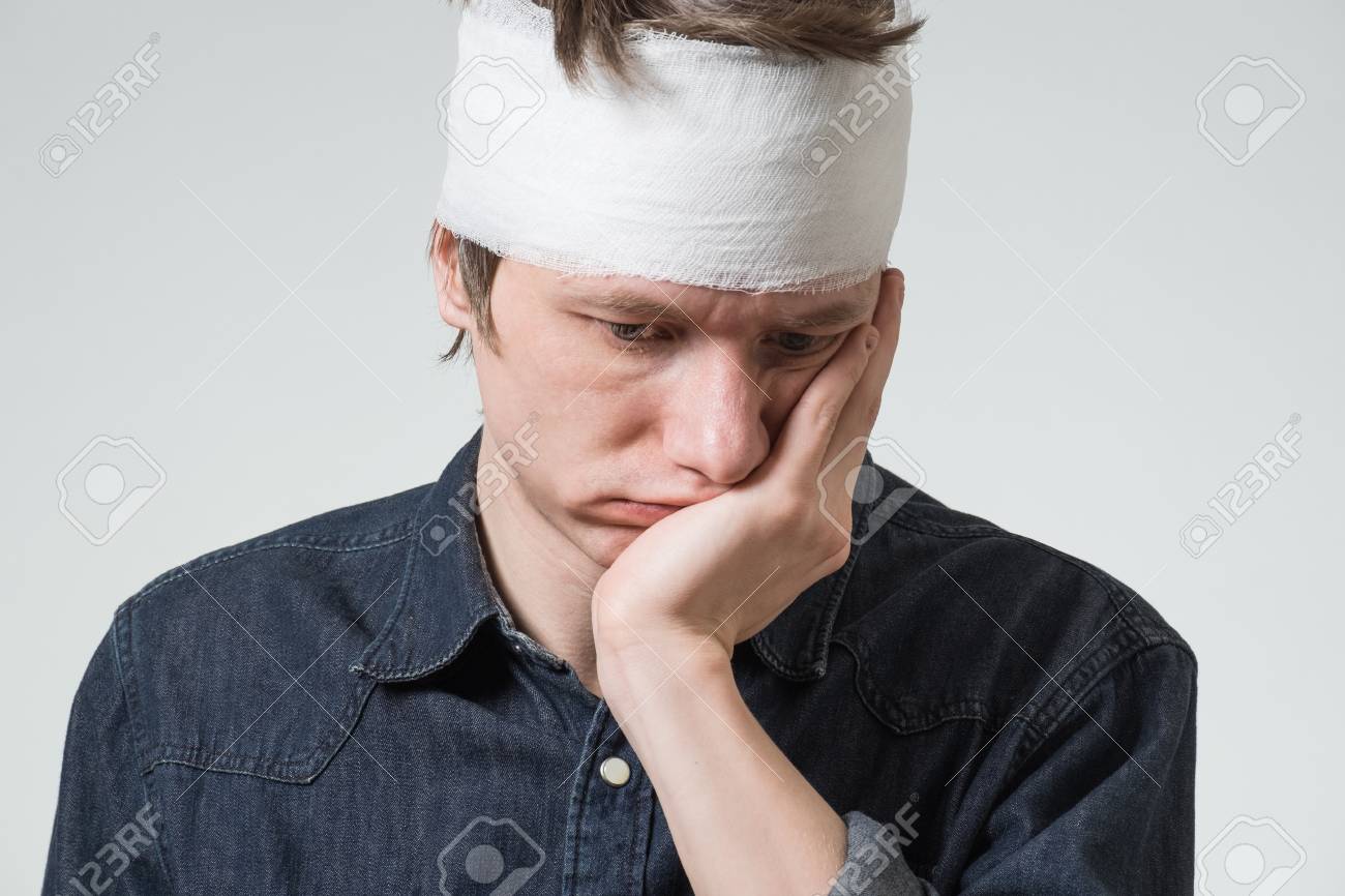 Injured Young Guy With Bandage On His Head Holding Cheek By Hand. Image  Related With Treatment Of The Wounds Stock Photo, Picture And Royalty Free  Image. Image 91202838.