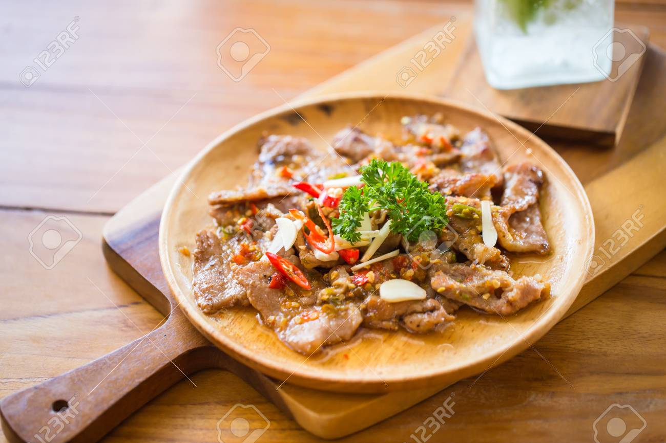 Pork Stir Fly With Spicy Garlic Served On Wood Table Thai Herbal