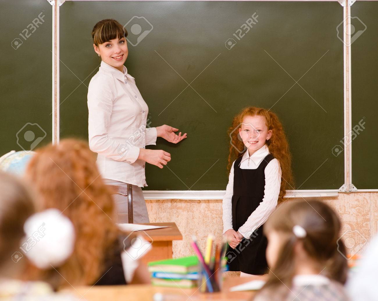 Schoolgirl And Teacher Near A School Board Stock Photo 22449928 Schoolgirl And Teacher Near A School Board Stock Photo 22449928