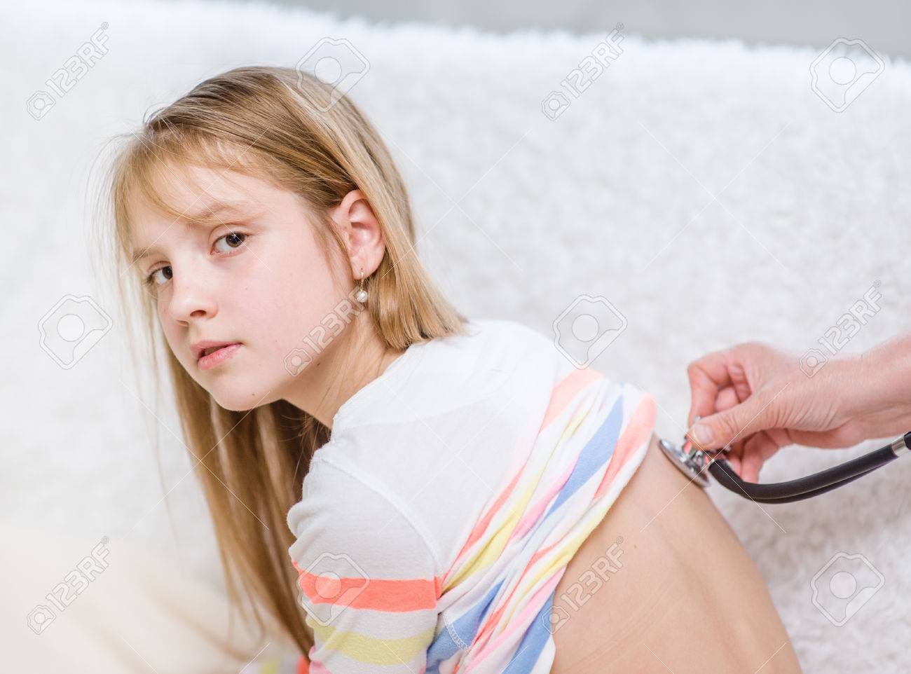 Doctor Examining Teen Girl Doctor Examining Teen Girl