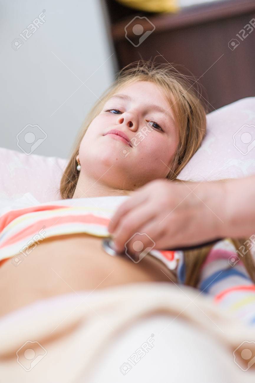 Doctor Examining Teen Girl Doctor Examining Teen Girl