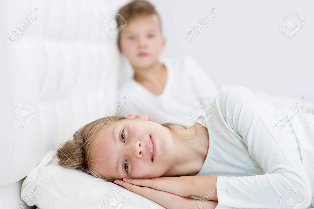 Happy Brother And Sister Lying On Bed Stock Photo 91022320 Happy Brother And Sister Lying On Bed Stock Photo 91022320
