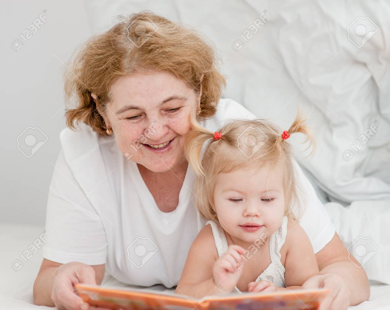 grandma reads book to baby
