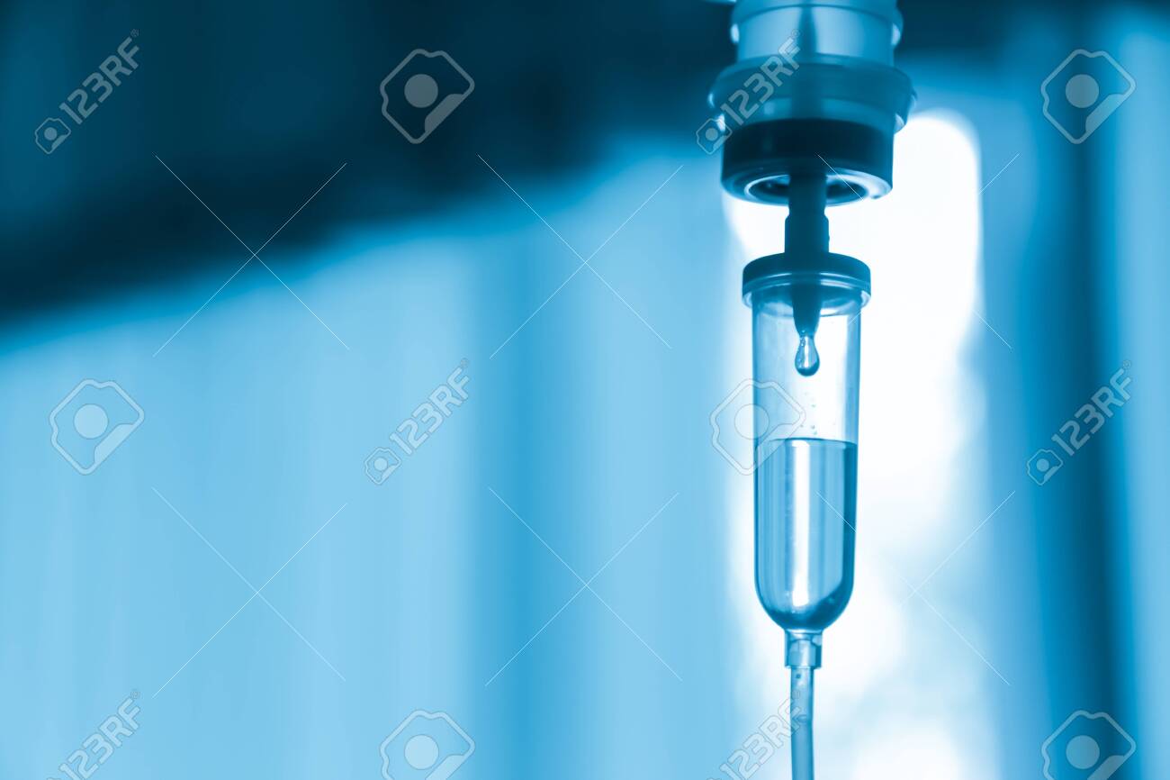 Saline iv bag intravenous drip hospital room Medical Concept treatment and injection vitamin natural drug infusion care chemotherapy concept.green light background hospital Selective focus - 134033869 Saline iv bag intravenous drip hospital room Medical Concept treatment and injection vitamin natural drug infusion care chemotherapy concept.green light background hospital Selective focus - 134033869