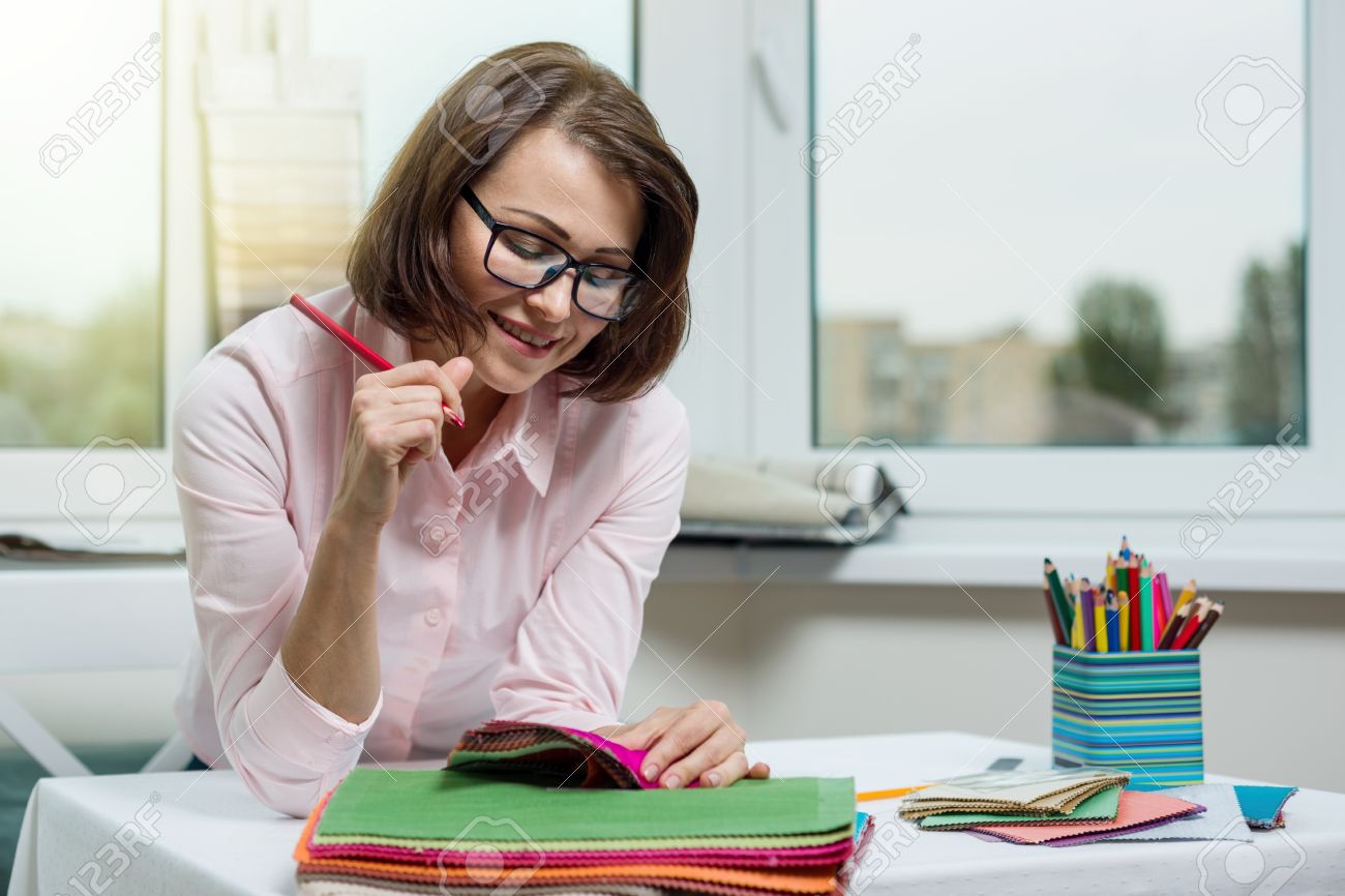 interior designer at the workplace in the office with samples