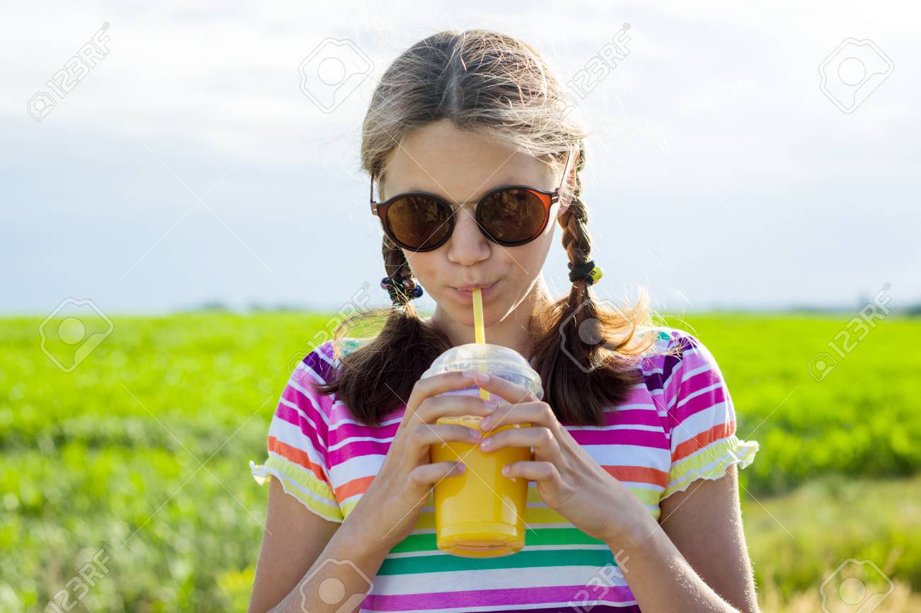 Happy Teen Girl Drinking Orange Juice At Hot Summer Day Outdoor Stock Photo 97403899 Happy Teen Girl Drinking Orange Juice At Hot Summer Day Outdoor Stock Photo 97403899