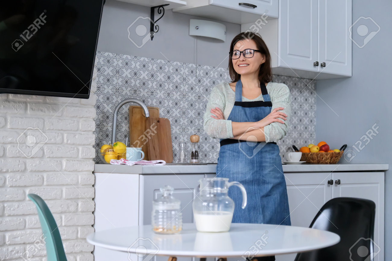 Home Portrait Of Mature Woman Housewife