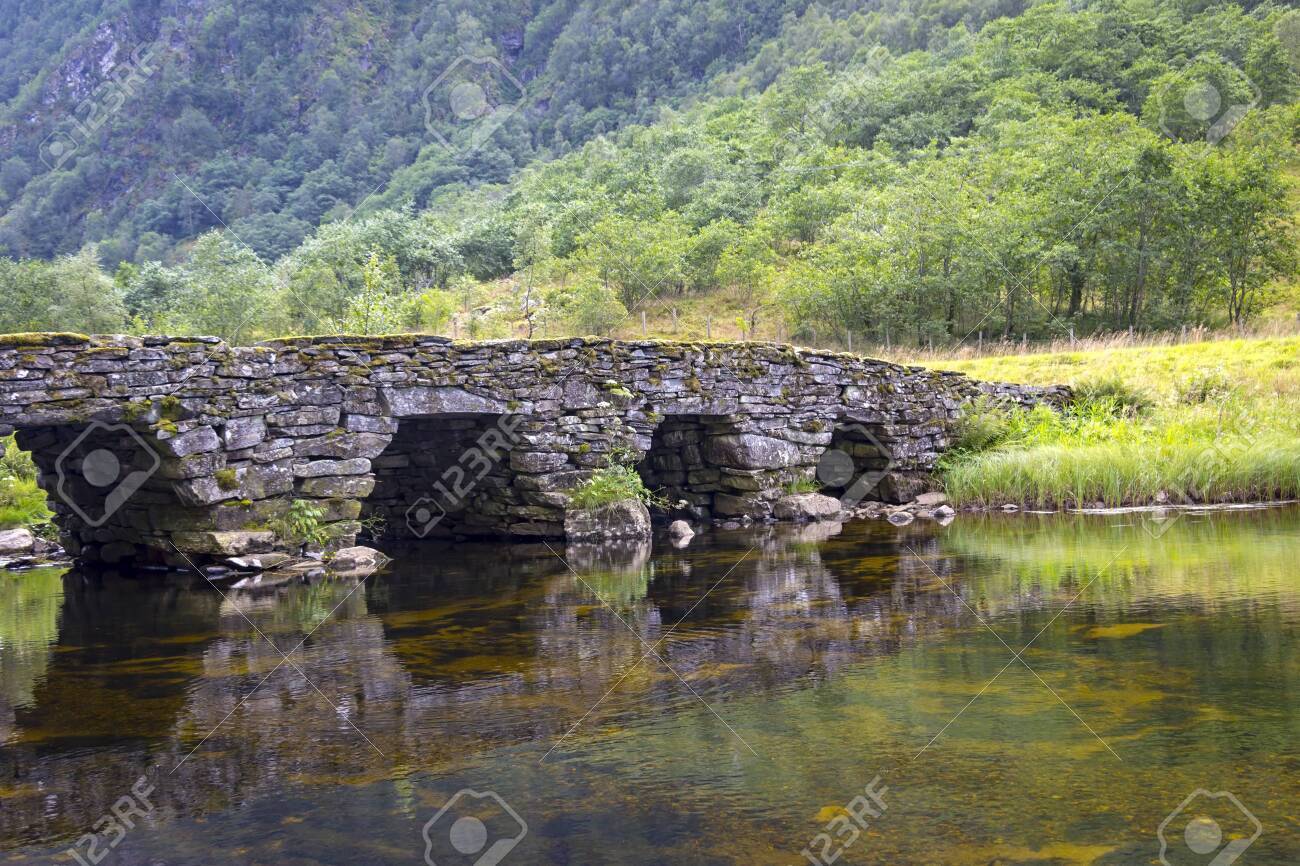 In A Small Valley An Old Stone Bridge Leads Across A River Seen Stock Photo Picture And Royalty Free Image Image