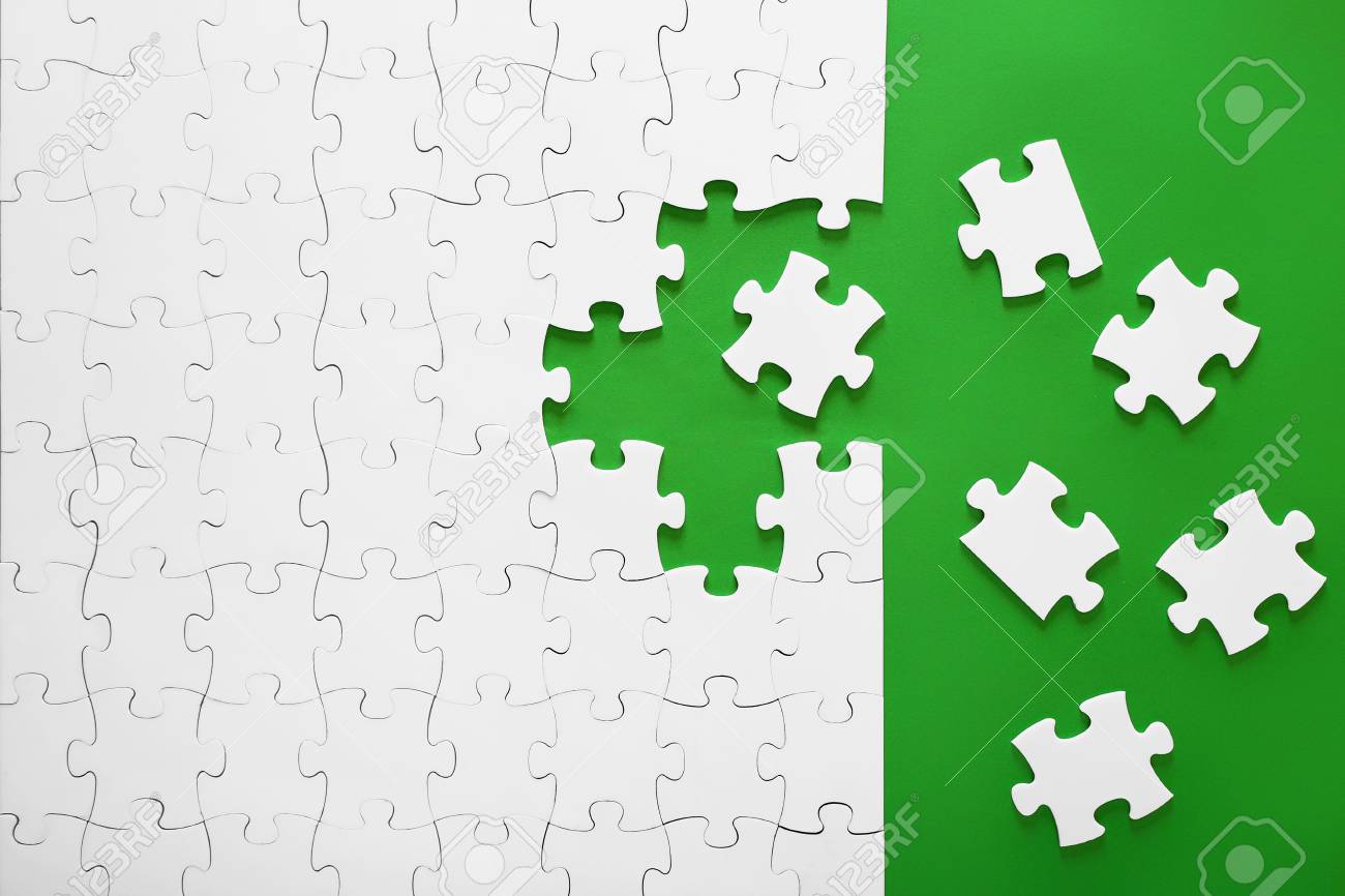 White puzzles on a green background. The puzzle pieces are put together. The header, the template for a business idea. Teamwork in the organization. - 111286177 White puzzles on a green background. The puzzle pieces are put together. The header, the template for a business idea. Teamwork in the organization. - 111286177