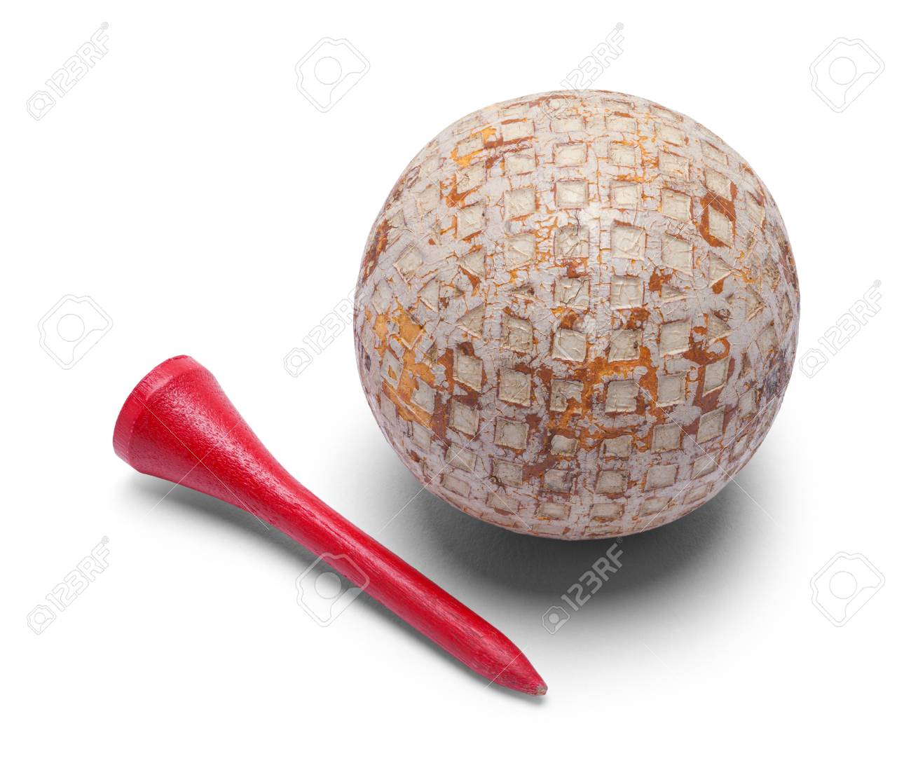 Old Golf Ball And Red Tee Isolated On A White Background Stock Photo Picture And Royalty Free Image Image