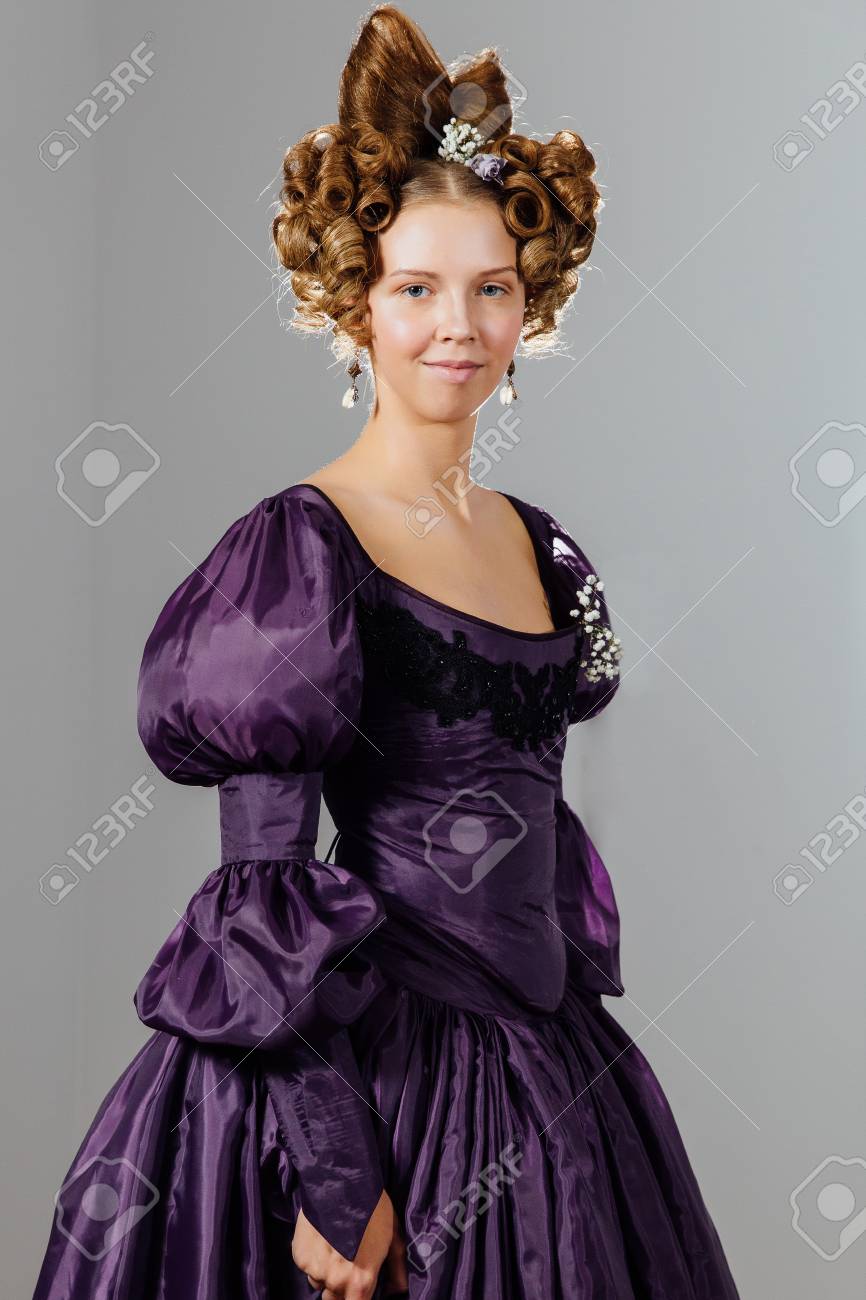 Beautiful Young Woman In Vintage Dress With Designer Hair Ball