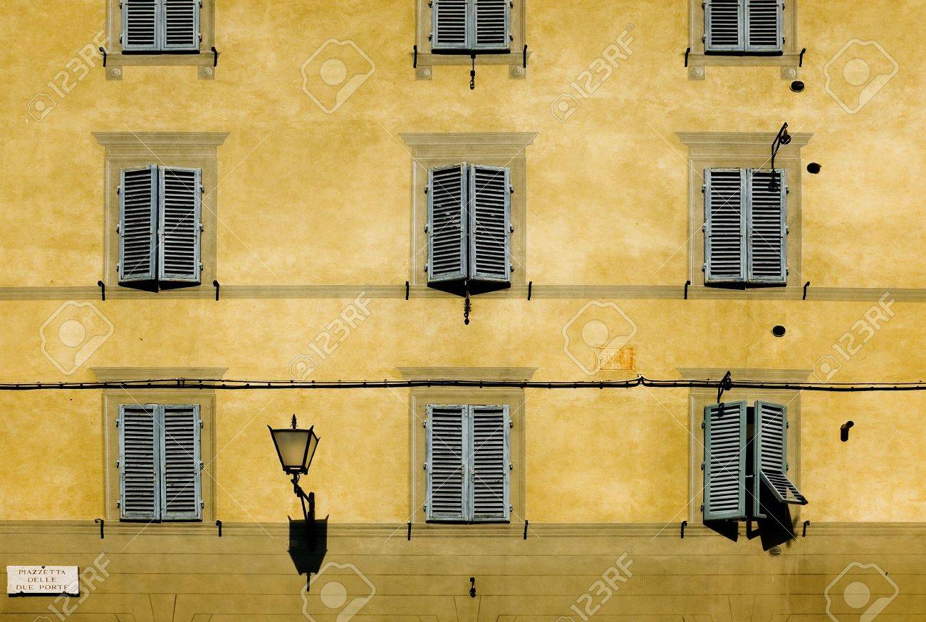 typical facade with windows of tuscan architecture siena, italy typical facade with windows of tuscan architecture siena, italy