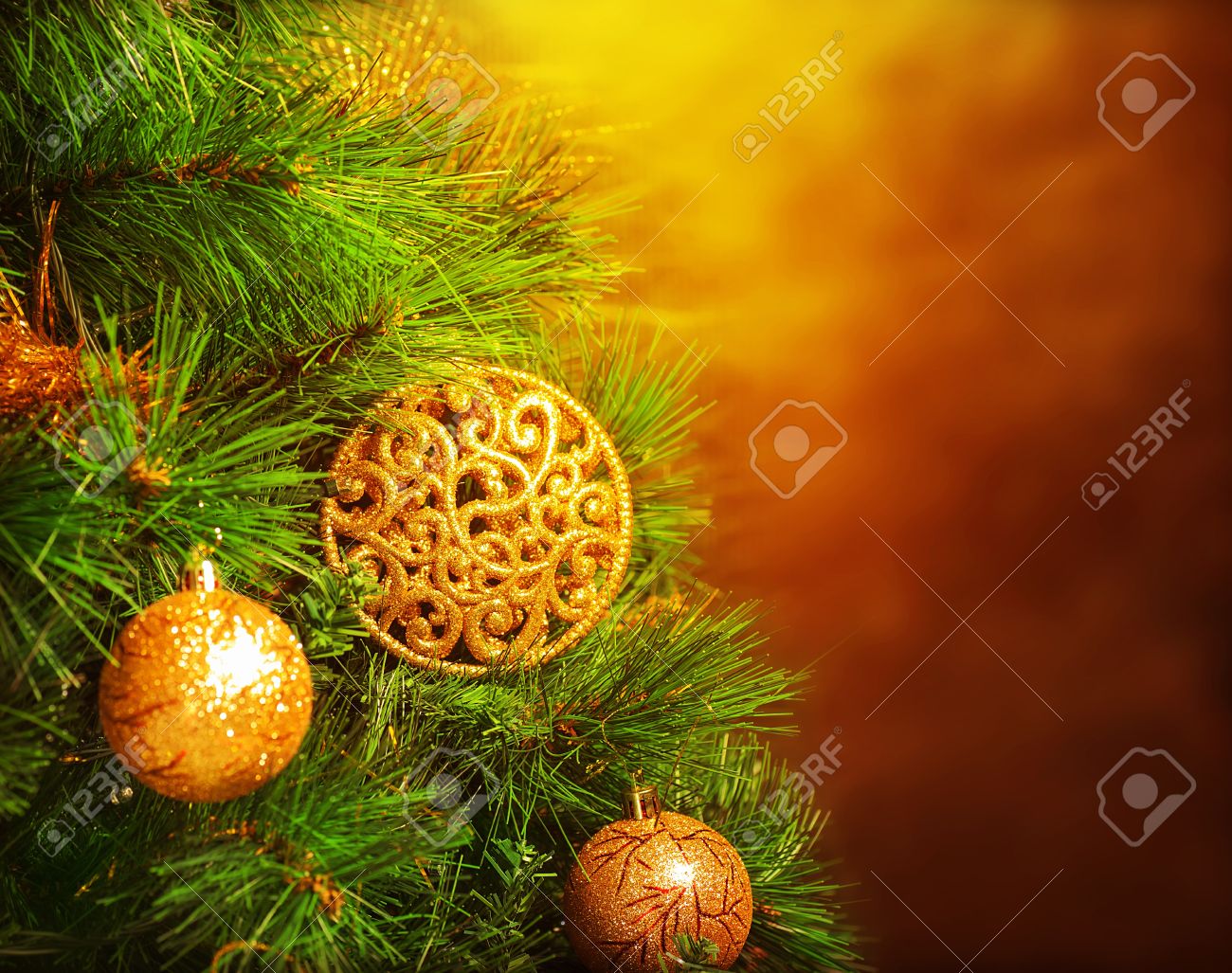 Photo of traditional Christmas tree isolated on brown grunge background, green fir decorated with golden bubbles toy, happy New Year greeting card, adorned pine tree at home, winter holidays - 16510563 Photo of traditional Christmas tree isolated on brown grunge background, green fir decorated with golden bubbles toy, happy New Year greeting card, adorned pine tree at home, winter holidays - 16510563
