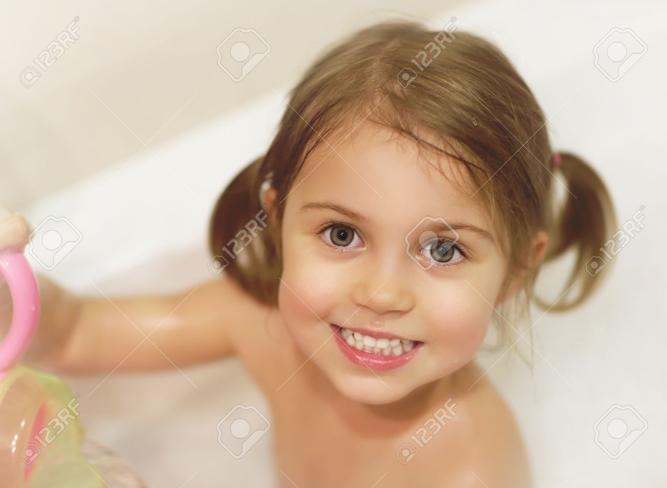 photo of cute baby girl taking bath happy childhood child s
