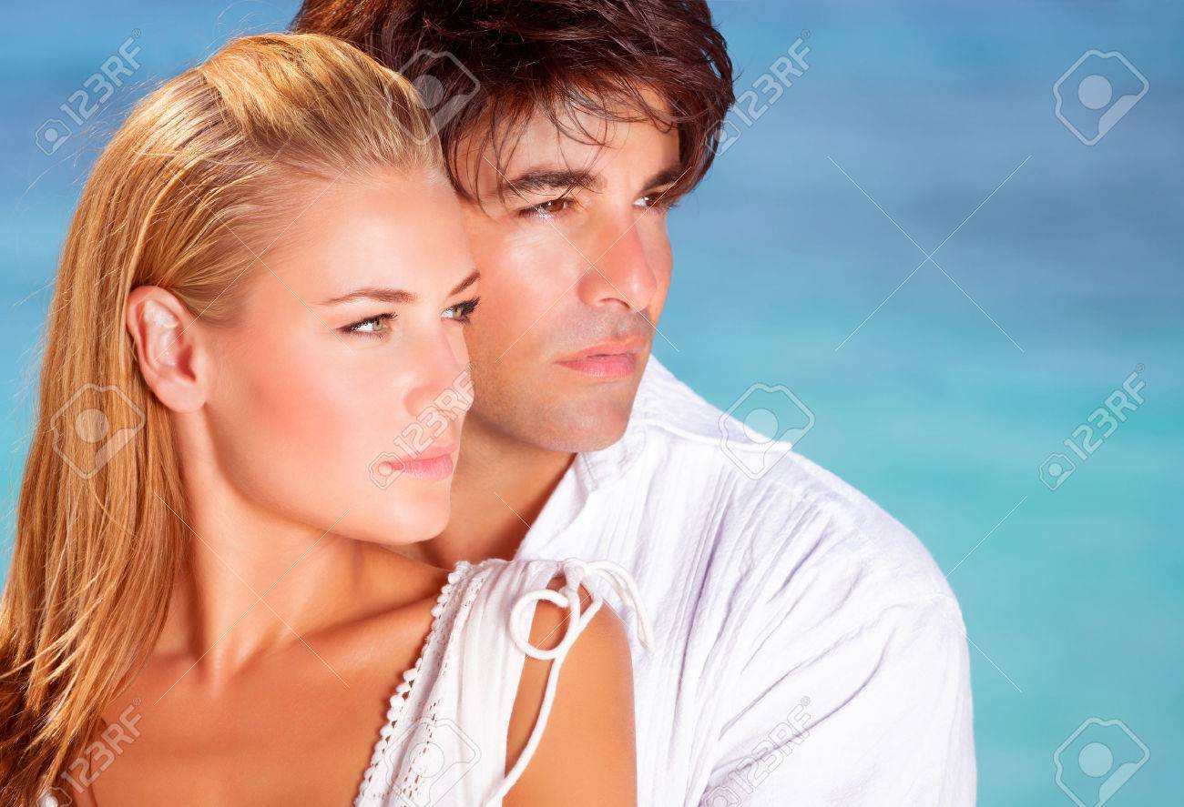 Closeup Portrait Of Lovely Couple Looking In Side On Blue Sea Stock Photo Picture And Royalty Free Image Image 27941295