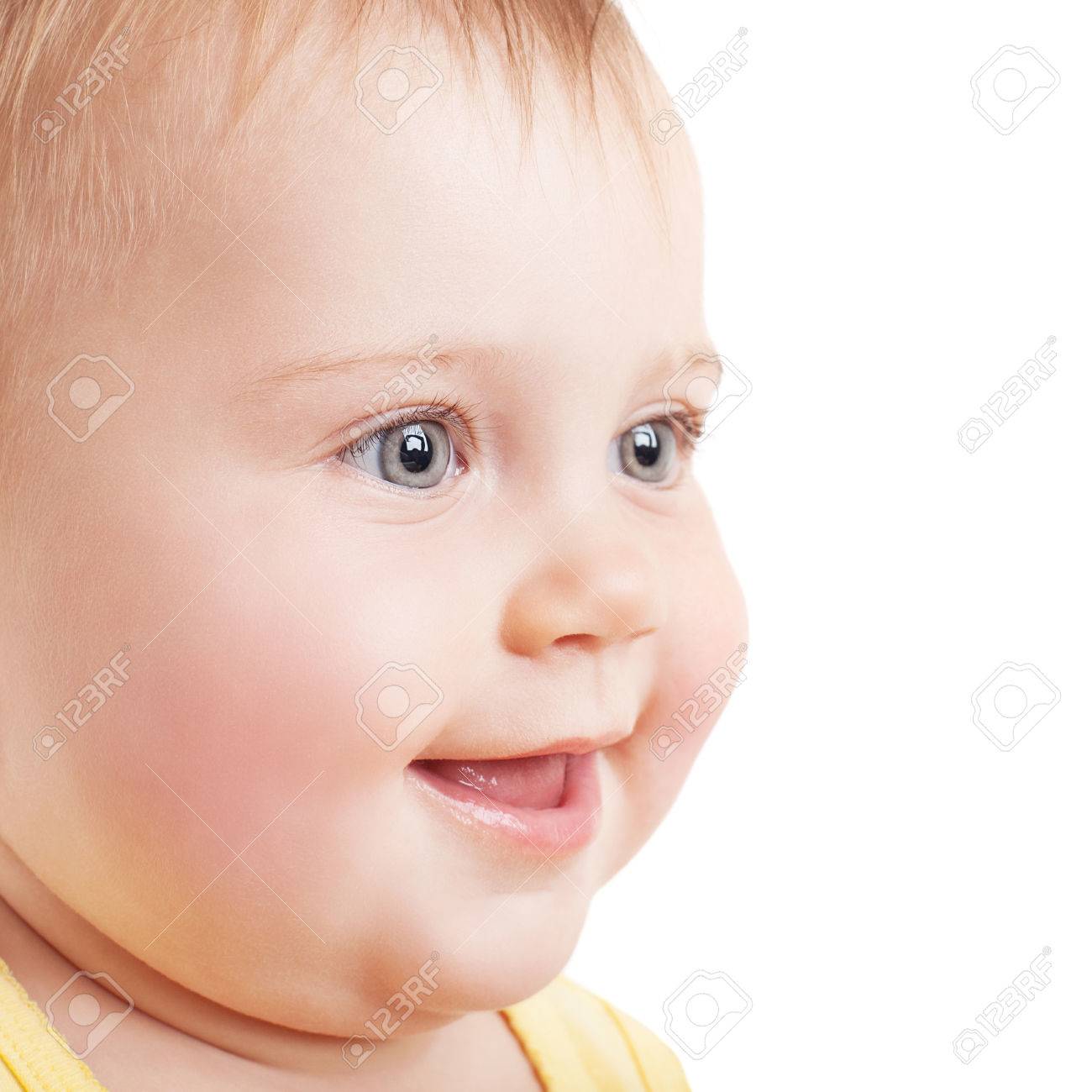 Closeup Portrait Of Cute Little Baby Face Isolated On White