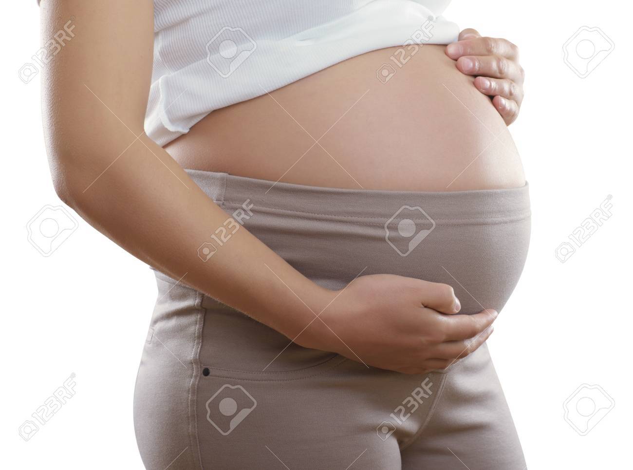 妊婦と白のブラウスに茶色のパンツで妊娠中の女性をクローズ アップ の写真素材 画像素材 Image