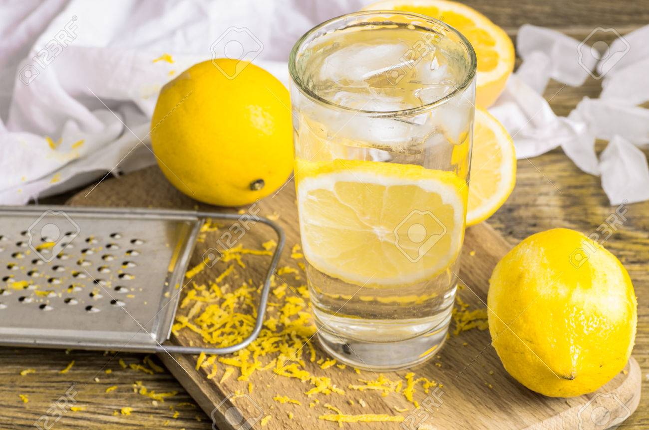 Glass Of Water Lemon, Zest And Lemon And Ice Stock Photo, Picture ...