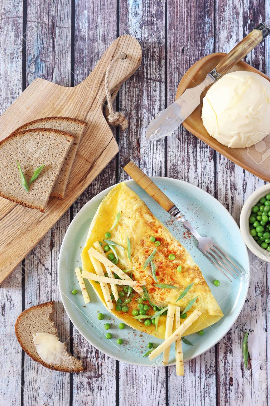 Green Peas Omelet With Hard Cheese On Blue Plate And Rye Bread Stock Photo Picture And Royalty Free Image Image