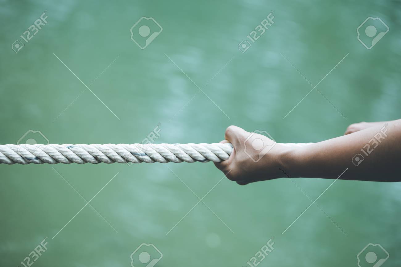 hands pulling on a rope Concept of being alone Strengthened - 110456939 hands pulling on a rope Concept of being alone Strengthened - 110456939