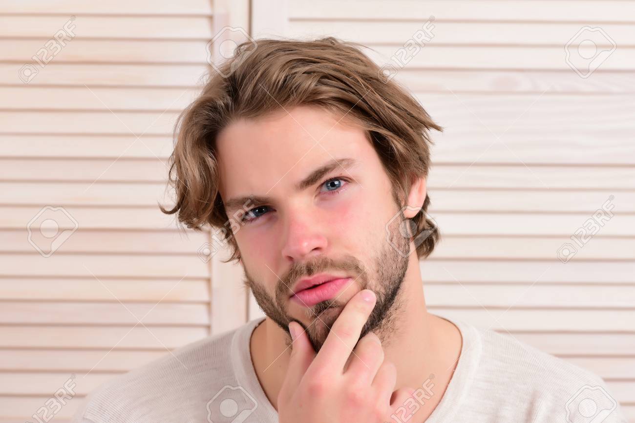 macho with fair beard and serious face guy with messy hair and
