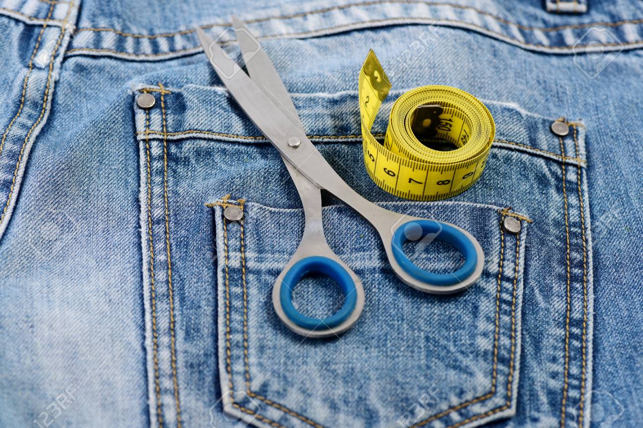 things for making clothes on back pockets of jeans close up