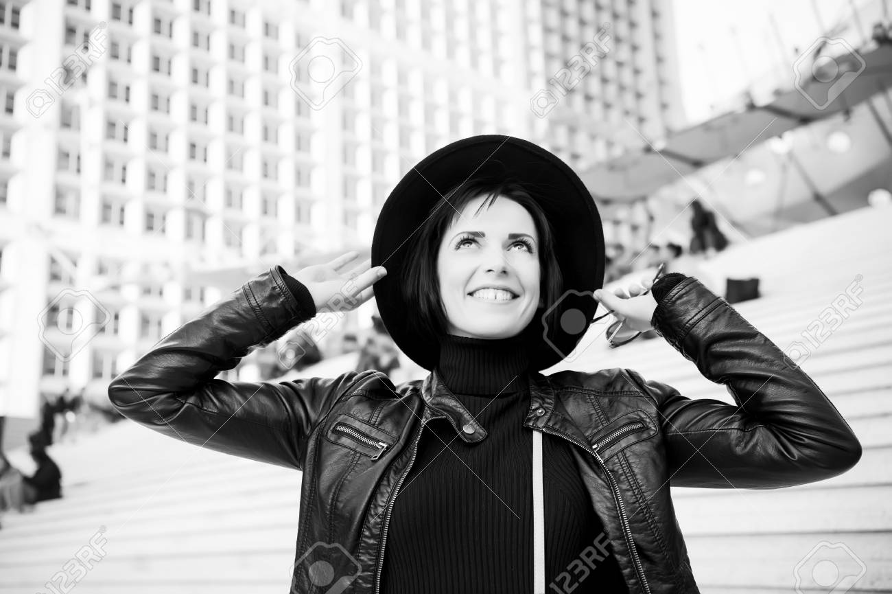Beauty and urban fashion. Fashion model pose smiling outdoor
