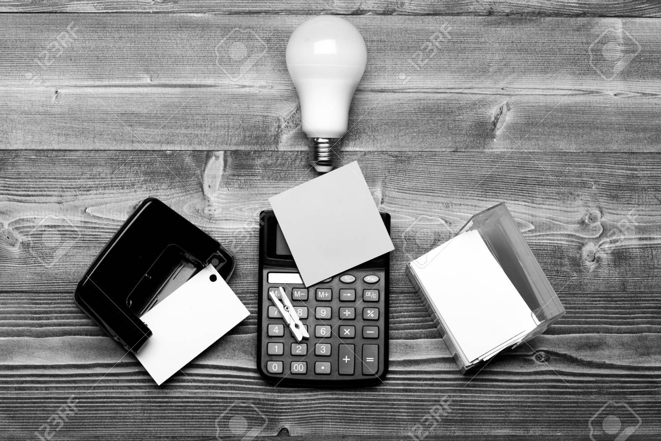 hole punch near light bulb calculator and card holder stock photo punch card calculator