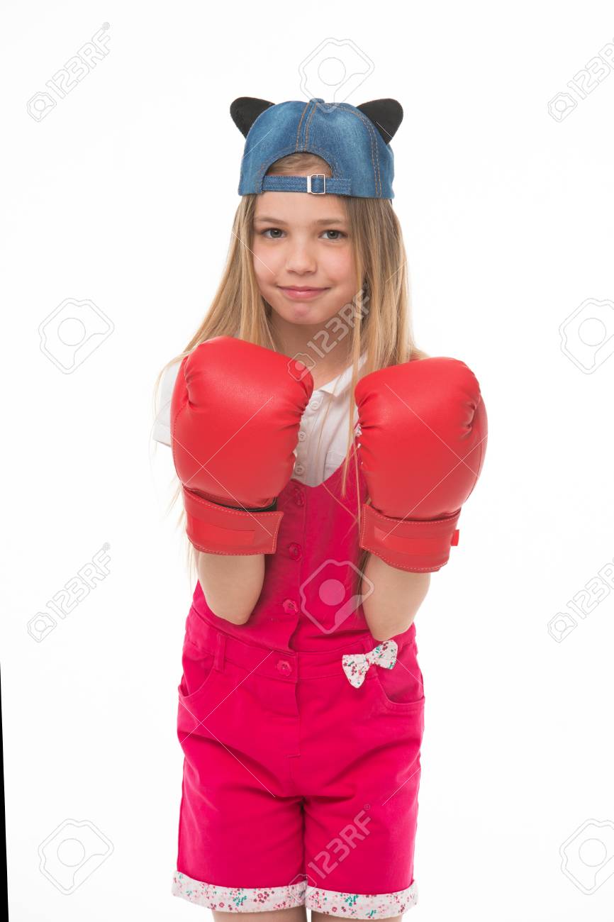 lovely child wearing huge red boxing gloves girl in pink overalls