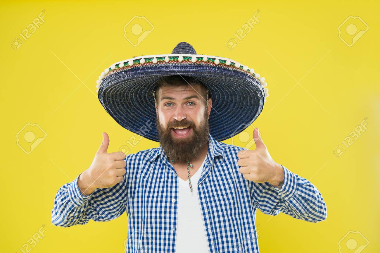 Maintain Tradition. Mexican Guy Festive Outfit Ready To Celebrate. Man  Bearded Cheerful Guy Wear Sombrero Mexican Hat Yellow Background. Mexican  Party Concept. Celebrate Traditional Mexican Holiday. Фотография, картинки,  изображения и сток-фотография без