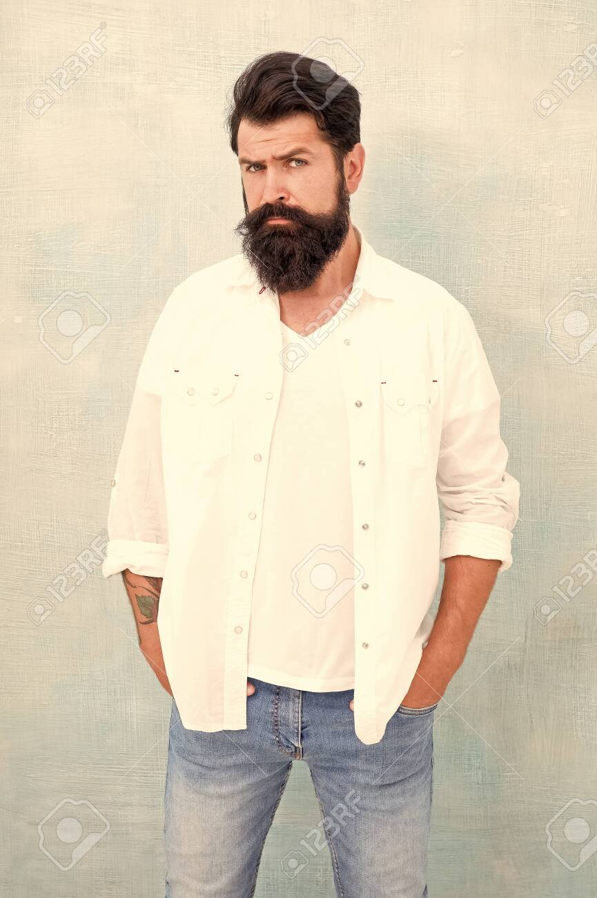handsome hipster jeans. male fashion and beauty. Masculinity concept. Summer season fashion trend. brutal macho gray background. Male temper brutality. bearded man radiate masculinity - 139456382 handsome hipster jeans. male fashion and beauty. Masculinity concept. Summer season fashion trend. brutal macho gray background. Male temper brutality. bearded man radiate masculinity - 139456382