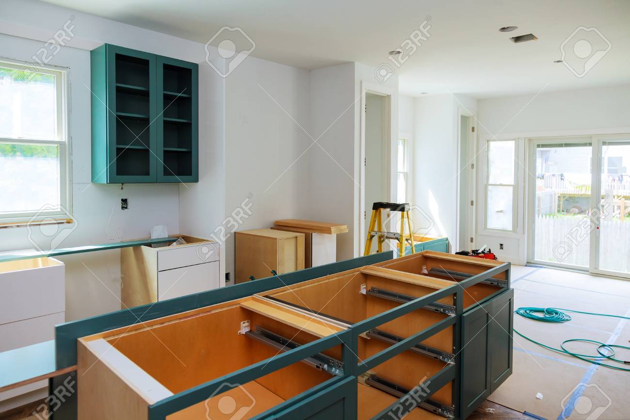 Custom Kitchen Cabinets In Various Stages Of Installation Base